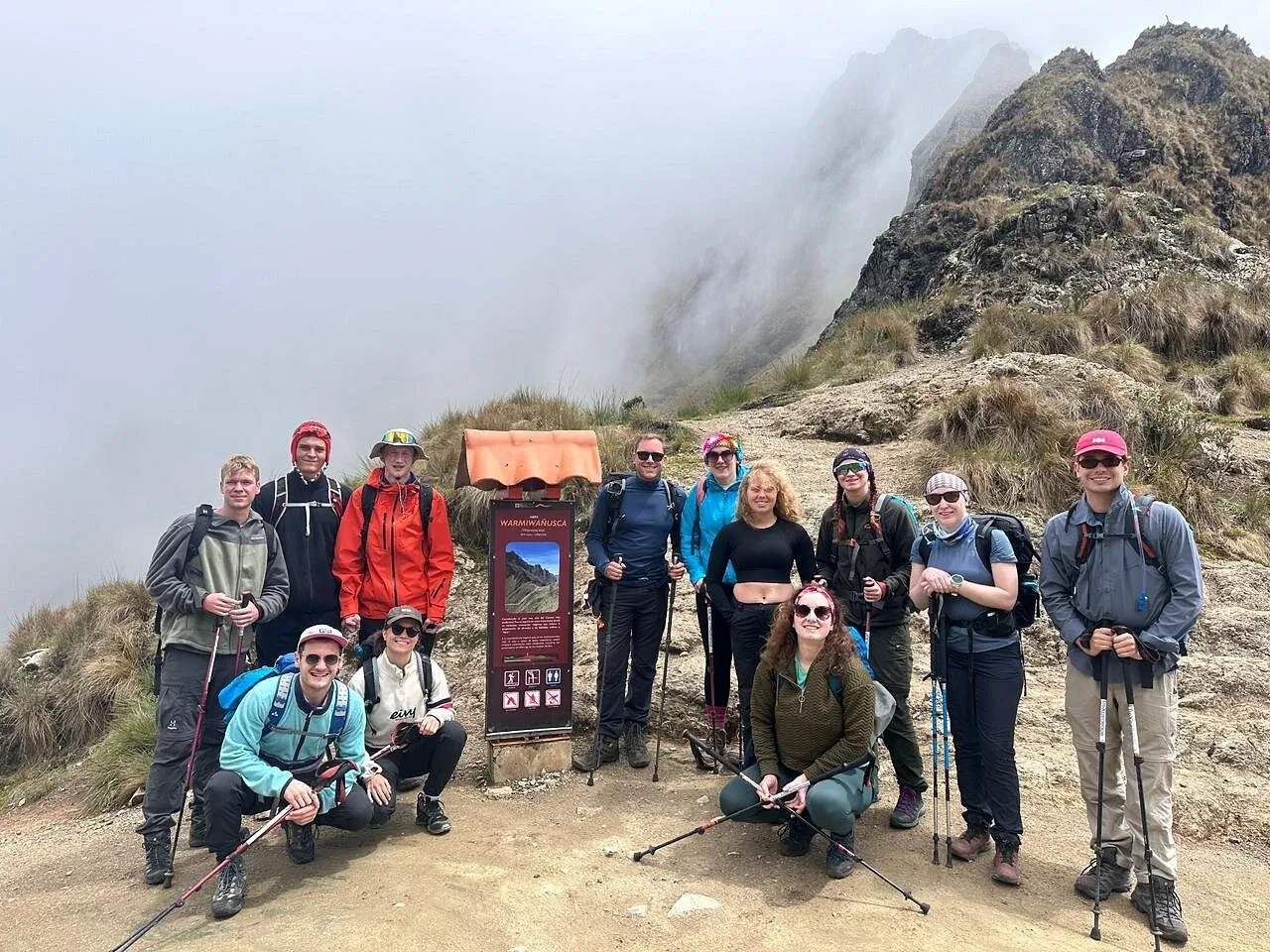 Trekkers at the top of Dead Woman's Pass in cloud
