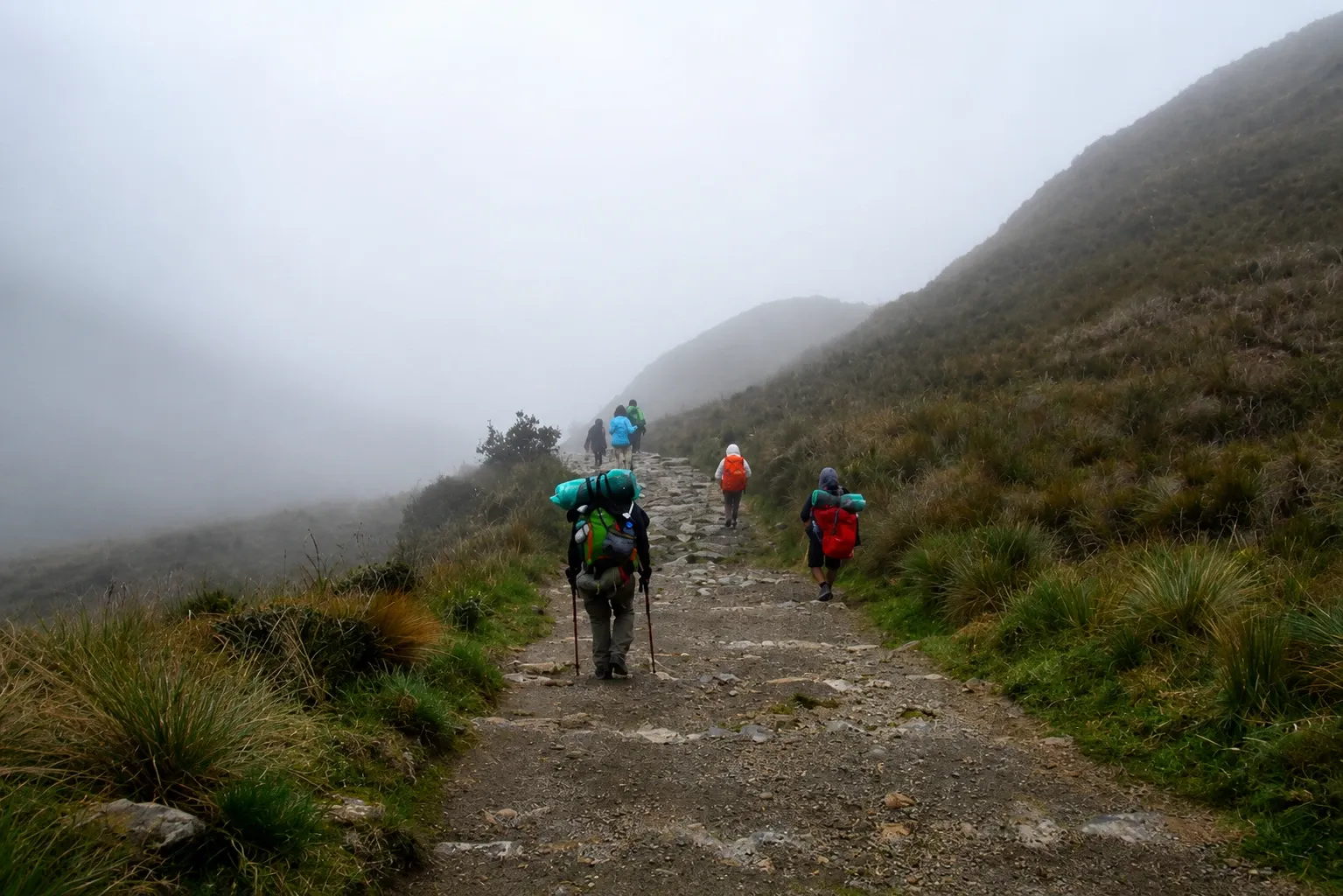 Porters and walkers on the Inca Trail in low cloud