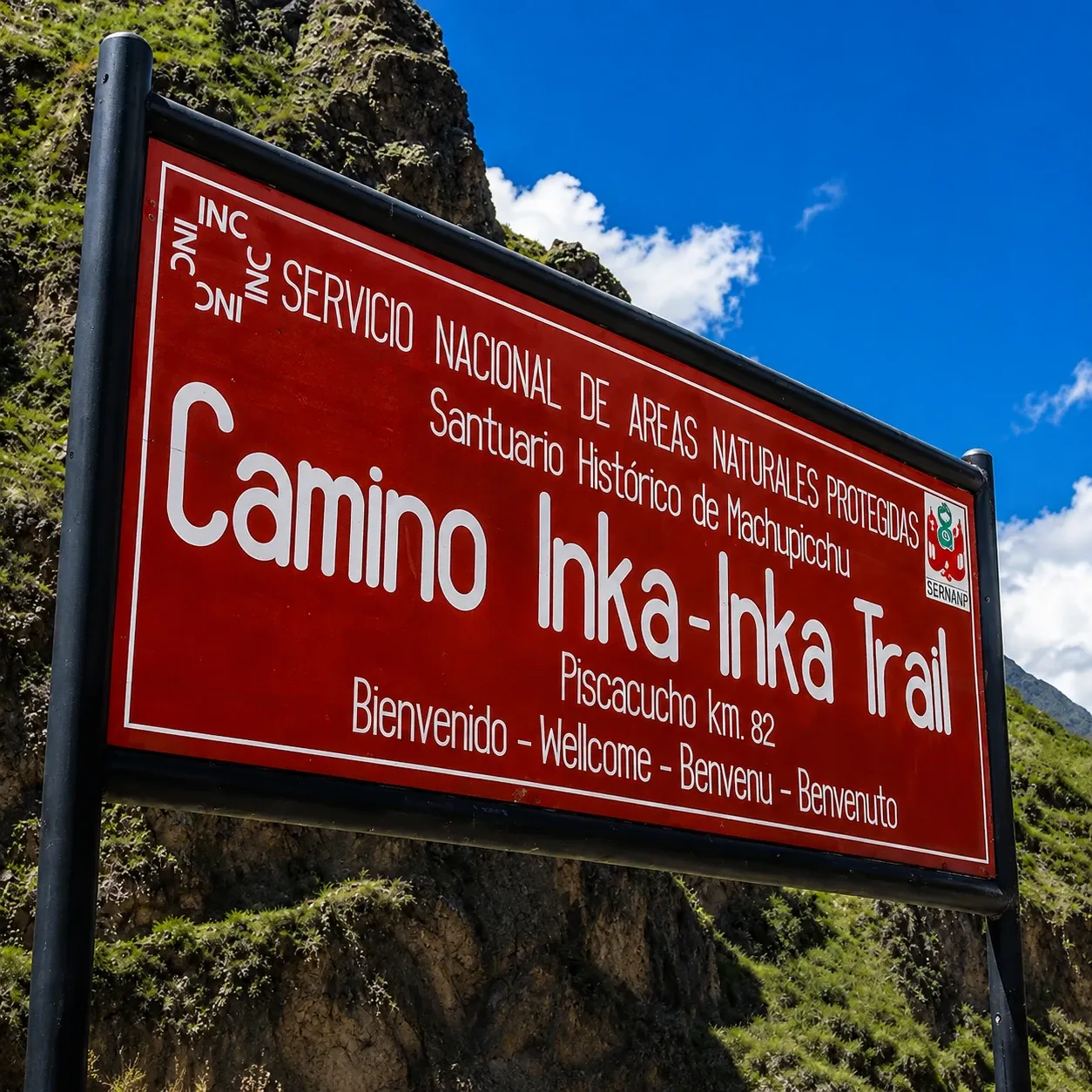 The red Camino Inka sign at the start of the Inca Trail