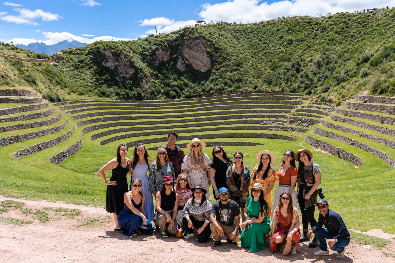 A group of travellers in front of the terraces of Moray