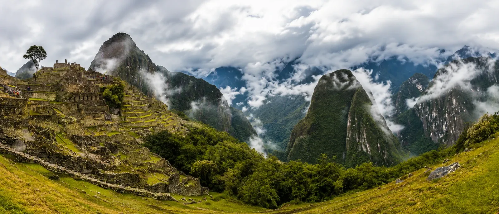 A panorama of Machu Picchu and the cloud-covered peaks around it