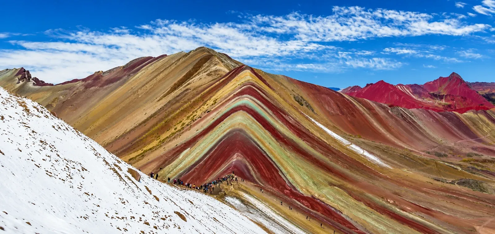 Rainbow Mountain with snow lying on its lower slopes