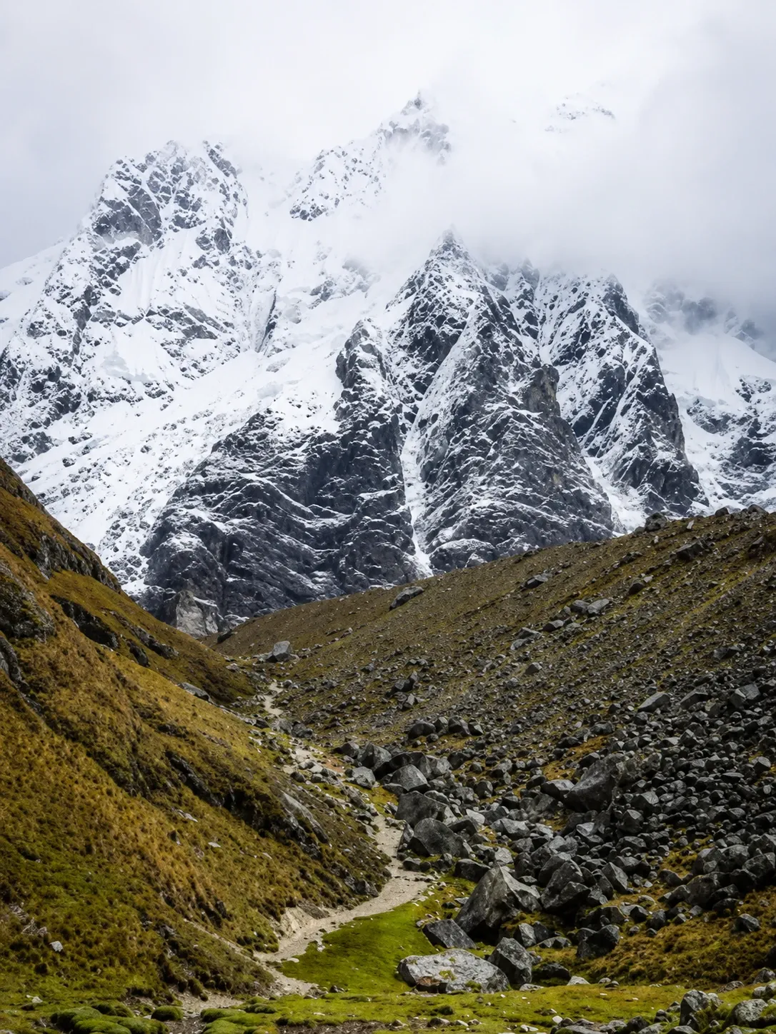 Salkantay's ice face above a boulder-strewn valley