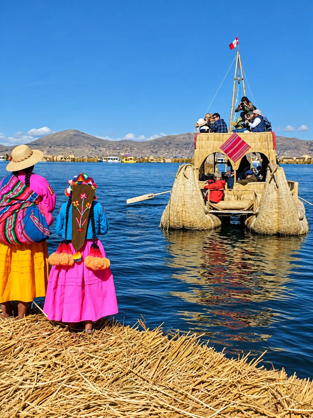 Two women in bright skirts on a reed island, watching a reed boat