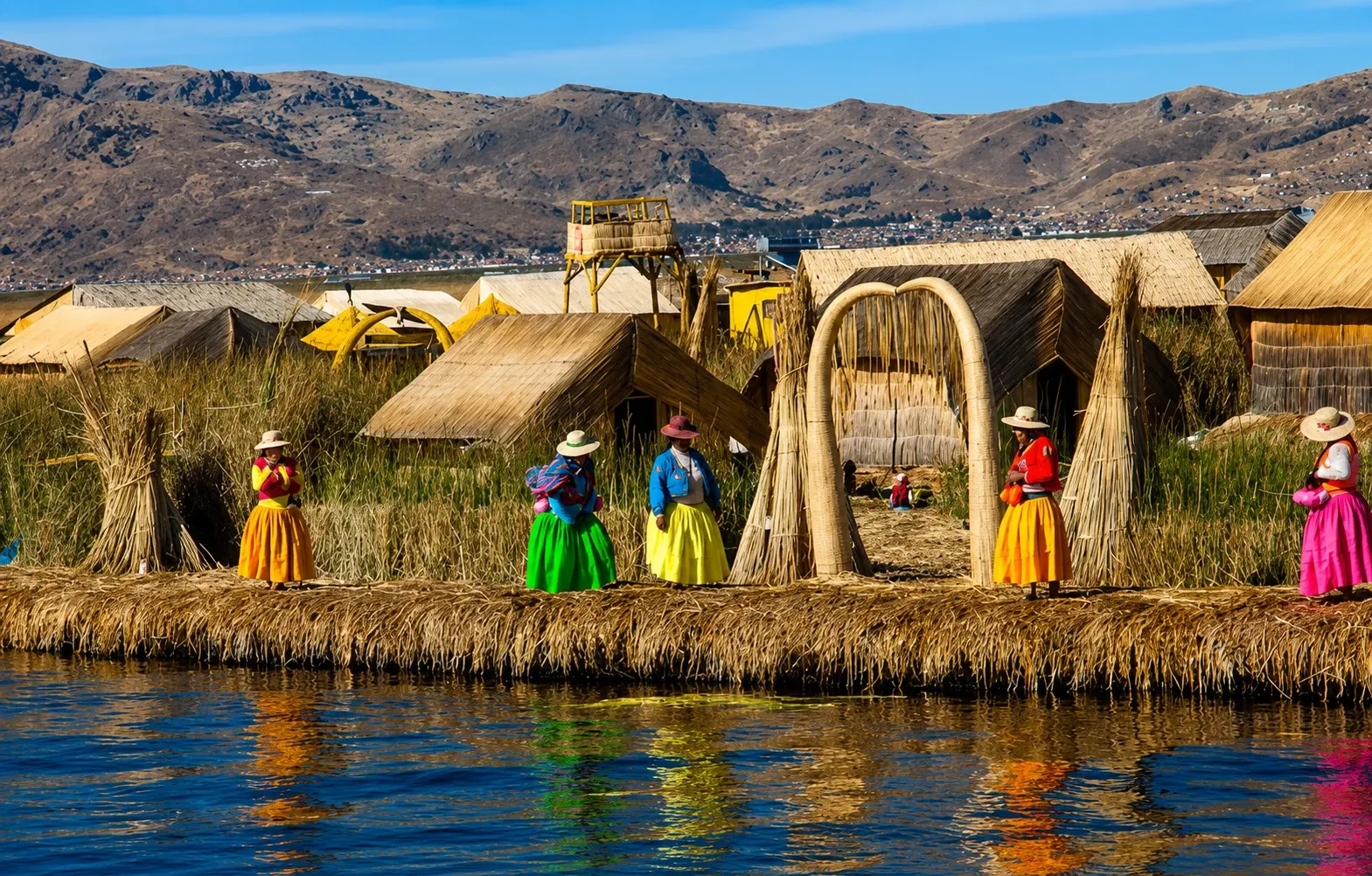 Reed houses and an arch on the Uros floating islands of Lake Titicaca